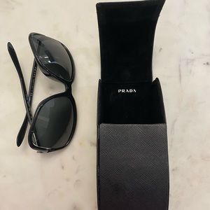 Prada sunglasses with case.